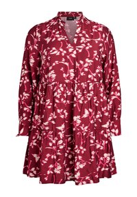 Raudona gėlių suknelė su baltais raštais, V formos iškirpte, ilgomis rankovėmis, kelių sluoksnių dizainu ir laisvu kirpimu. Pagaminta iš lengvos medžiagos.