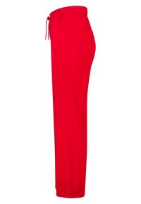 Pantalons de survêtement rouges avec une taille élastique et un cordon de serrage, dotés de poches latérales et d'une coupe droite. Fabriqués en tissu doux et respirant.