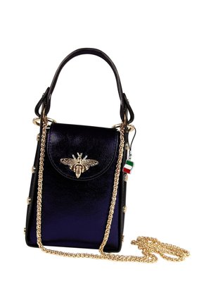 Small glossy black handbag with gold bee ornament on front flap, gold chain strap, black top handle, and Italian flag charm attached.