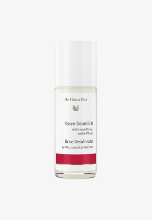 Klarer Glas-Deodorantbehälter mit einem weißen Deckel. Das Etikett zeigt "Rosen Deomilch" und "Rose Deodorant" in schwarzer Schrift, akzentuiert durch einen roten Streifen.