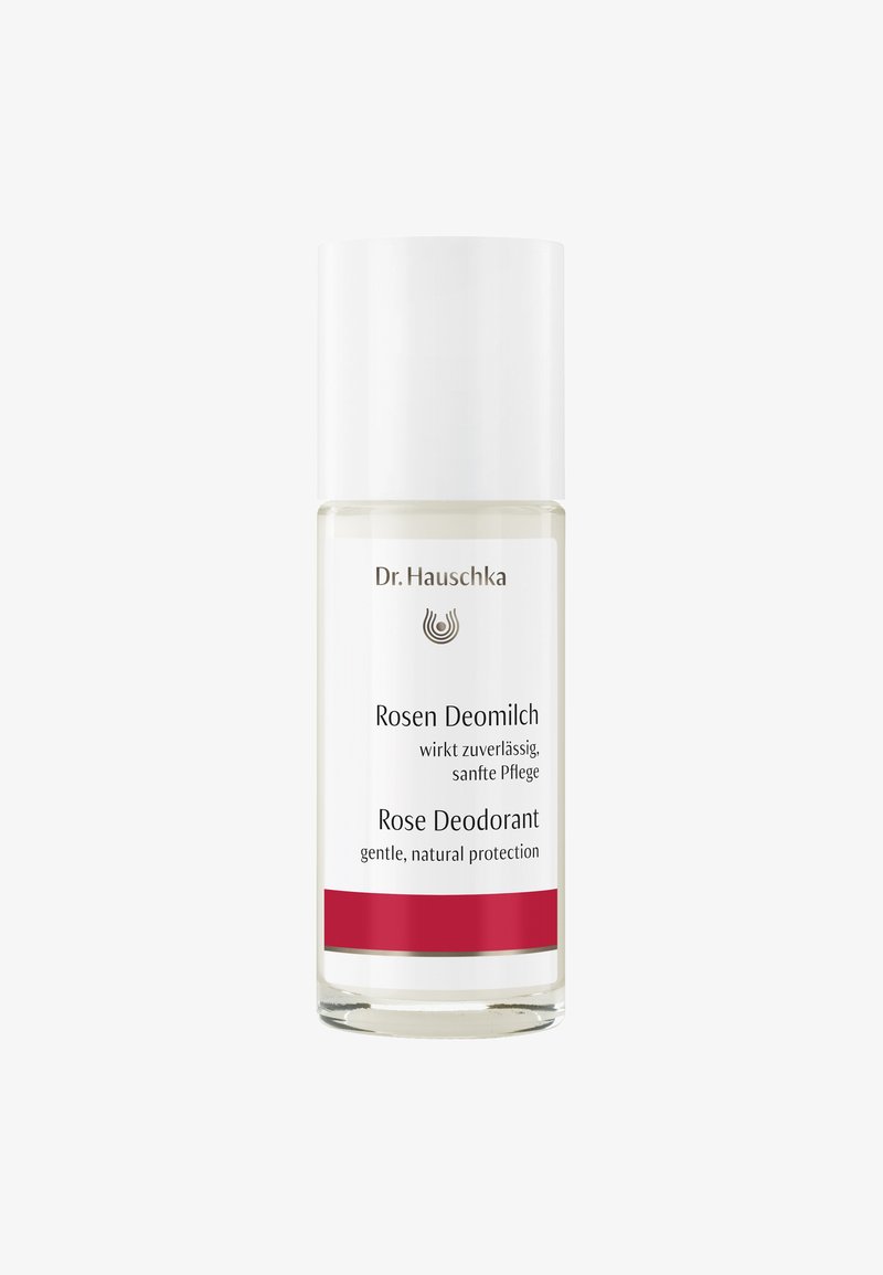 Bouteille de déodorant en verre transparent avec un capuchon blanc. L'étiquette affiche "Rosen Deomilch" et "Déodorant Rose" en texte noir, rehaussé par une bande rouge.