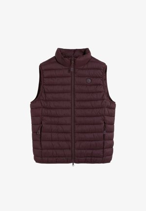 Chaleco sin mangas acolchado de color marrón oscuro con cuello alto y cremallera frontal, con dos bolsillos laterales con cremallera y un pequeño logo circular en el pecho.