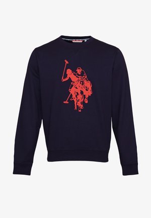 Sweat-shirt à manches longues bleu marine avec un graphisme rouge représentant deux joueurs de polo à cheval, tenant des maillets en plein match, centré sur la poitrine.