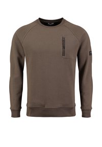Sudadera marrón con cuello redondo, mangas raglán y un bolsillo en el pecho con cremallera. Textura suave con puños y dobladillo de canalé.