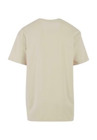 Beige bomulls t-skjorte, korte ermer, avslappet passform, rund hals, ensfarget uten mønstre eller grafikk, glatt tekstur og myk kvalitet.