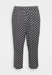 Zwart-wit gemusterde broek met een elastische tailleband, uitgerust met een geometrisch ontwerp en een verkorte lengte. Lichte, gladde stof.