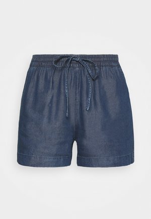 Džinsu šorti ar elastīgu jostasvietu, regulējamu auklu un brīvu piegriezumu. Tumši zila krāsa ar gludu tekstūru un sarullētām malām.