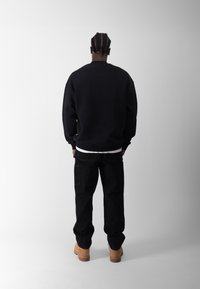 BLKVIS ATELIÉR DOUBLE KNEE UNISEX - Tööteksad - black