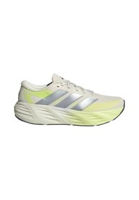 Beige and neon yellow running shoe with silver stripes, cushioned sole, and lace-up design, shown from the outer side.
