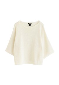 Lys cremet oversized sweater med rund halsudskæring og korte, brede ærmer. Strikket tekstur med en blød finish og en afslappet silhuet.