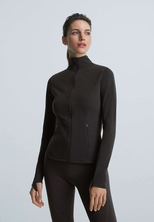COMFORT WARM - Training jacket - black