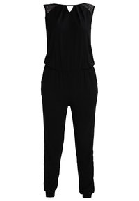 Combinaison noire avec un décolleté en trou de serrure, des accents en dentelle aux épaules et une taille élastique. Comprend des ouvertures de jambes fuselées et des poches latérales.