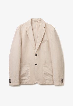 Blazer en velours côtelé beige avec deux boutons noirs, revers crantés, deux poches plaquées devant et poignets boutonnés.