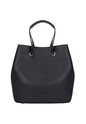 Sac cabas en cuir noir avec deux poignées passant à travers des œillets en métal doré, présentant un marquage discret "EXPATRIÉ" près du bas au centre.