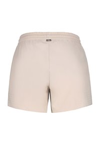 Ljusbeige träningsshorts med elastisk midja, slät yta och perforerade detaljer på sidorna för ventilation.
