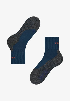 Calzini blu navy con polsino a coste, tallone e punta grigie. Presentano motivi testurizzati e piccole scritte colorate sui lati.