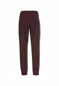 Burgunderfarbene Hose mit elastischem Bund und schmal zulaufendem Bein, elastischen Bündchen und zwei Gesäßtaschen. Glatte Textur und leichtes Material.