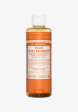 Klar plastflaske med Dr. Bronner's 18-i-1 tea tree såpe, med oransje etikett som har tekst. Inneholder 240ml med flytende såpe.