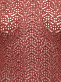 Tissu en dentelle crochet rose poudré délicate avec des motifs chevrons et floraux circulaires répétés, présentant un design ajouré raffiné.