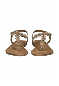 Sandali in suede beige con suola piatta. Presentano decorazioni con perline lungo il T-strap, aggiungendo texture e dettagli. Cinturino alla caviglia regolabile.