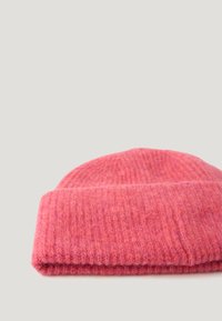 Knit beanie in bright pink with a ribbed texture and folded cuff, constructed from soft wool material.