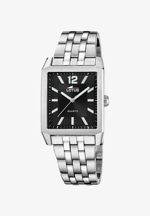 Kovové hodinky s oválnym strieborným puzdrom z nerezovej ocele, čiernym ciferníkom, striebornými indexmi a prepojeným kovovým remienkom. Viditeľné logo značky.