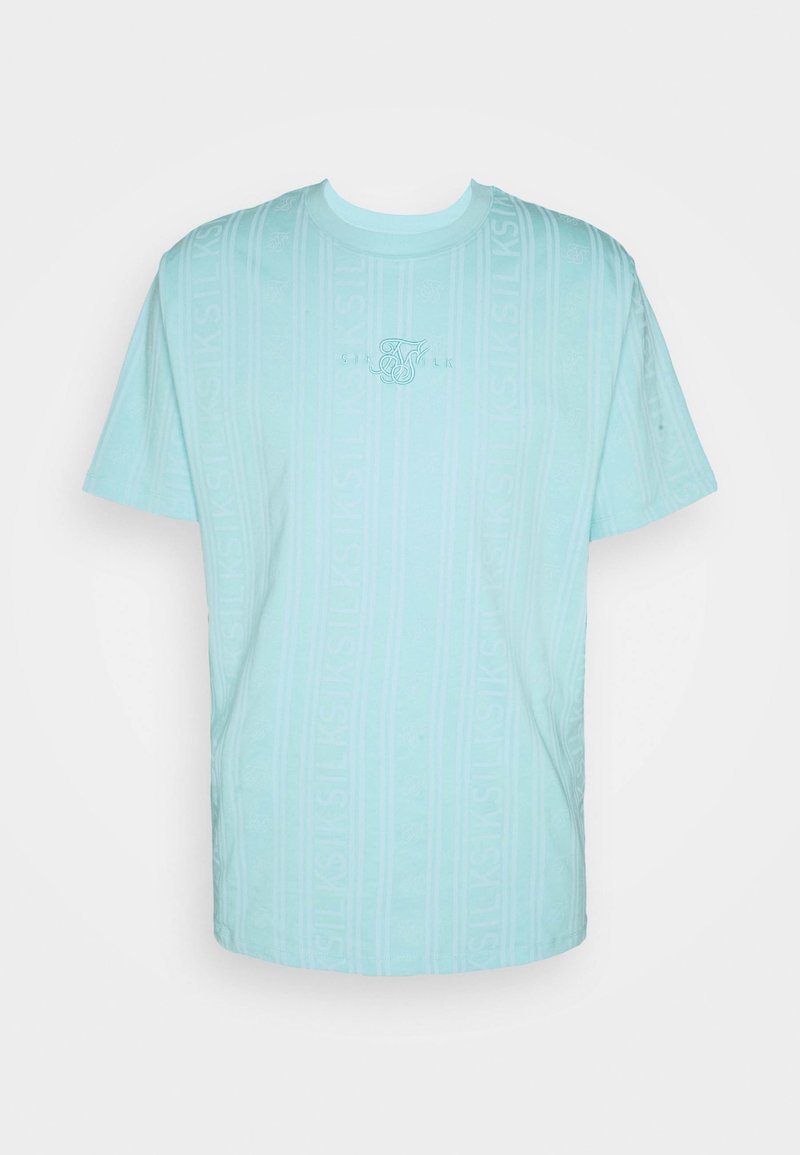 T-shirt bleu clair à manches courtes, présentant un motif vertical subtil et un petit logo au centre. Matière douce avec un col rond.