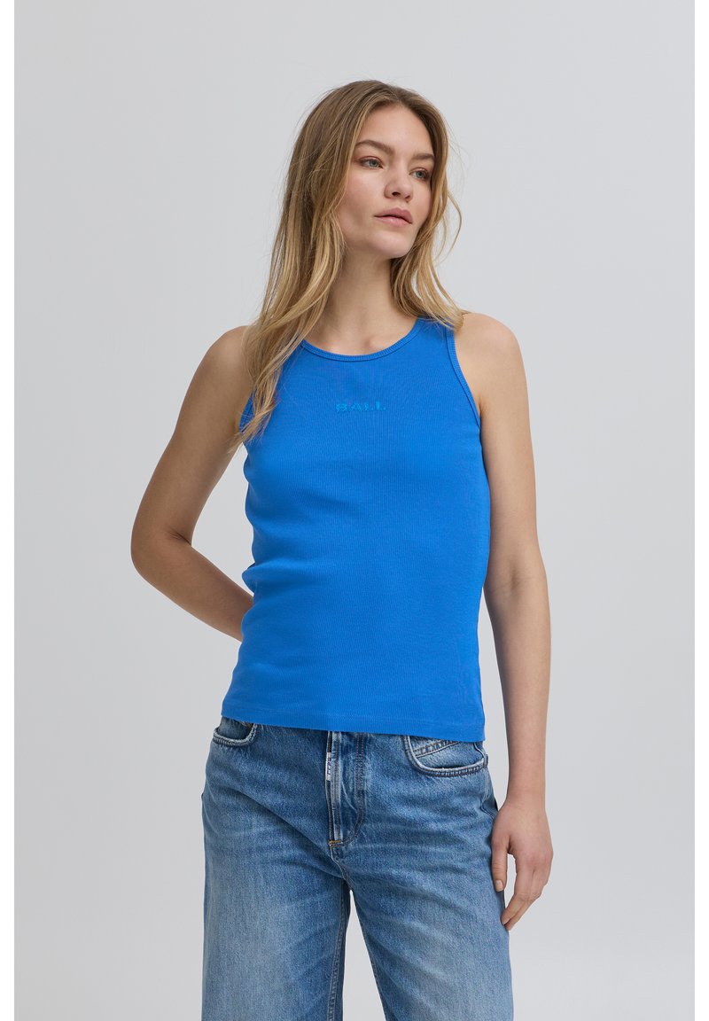 Blue ribbed tank top with a round neckline, featuring subtle branding on the front. Worn with light denim jeans. Smooth texture and fitted design.