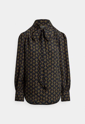 Fekete blúz finom masni nyakkal. Egész felületén arany grafikai mintával, fodros ujjakkal és szabott szabással.