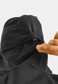 Black hooded garment featuring a smooth texture, elastic drawstring with a plastic toggle, and seam detailing at the shoulders.