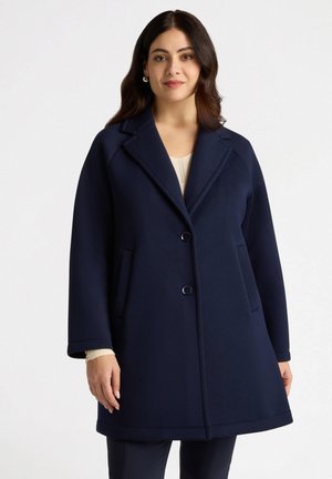 Navy blue, long coat made of a smooth fabric, featuring a notched collar, two front pockets, and two button closures. Tailored fit.