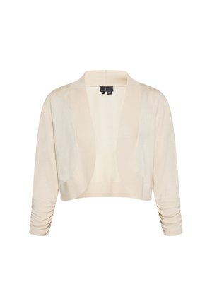 Beige cropped cardigan lavet af et blødt strikmateriale. Har en sjalskrave, lange ærmer og samlede detaljer ved ærmerne.