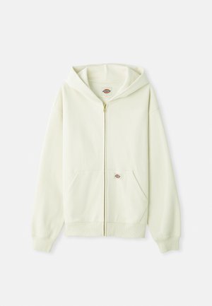 Gaišas krēma krāsas zip-up kapuce, kas izgatavota no mīkstas auduma, ar priekšējo kabatu, ribotām piedurknēm, kapuci ar auklu un nelielu logo uz krūšu daļas.