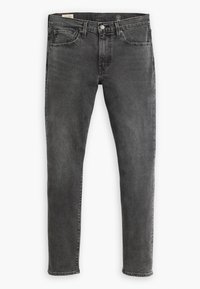 Jeans de denim gris ajustados, con un acabado desgastado. Presentan cinco bolsillos, trabillas para el cinturón y un cierre de cremallera con botón. Superficie limpia y texturizada.