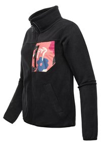 Veste en polaire noire avec un col haut et une fermeture éclair à l'avant. Présente un design de poche floral coloré en rose, bleu et blanc. Texture lisse.