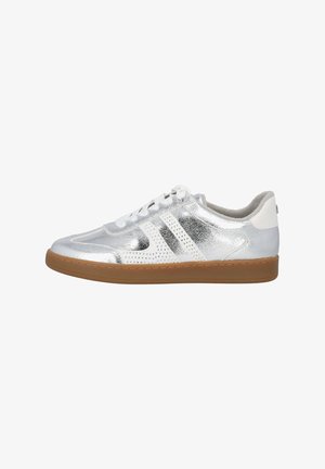 Silver athletic shoe with perforated design, three white stripes, and a gum-colored rubber sole. Features lace-up closure and padded collar.