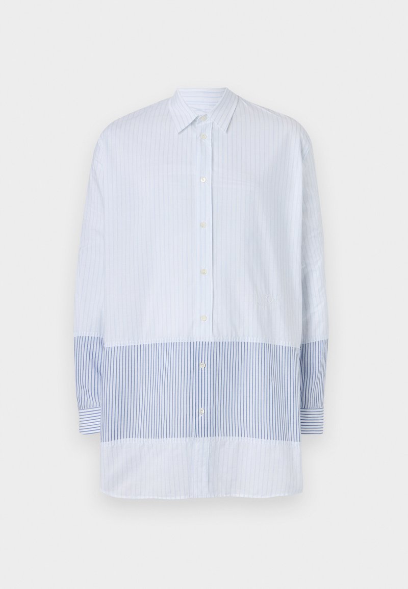 Light blue button-up shirt with vertical stripes, featuring contrasting horizontal stripes at the bottom and long sleeves.