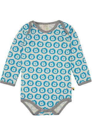 Pagliaccetto a maniche lunghe di un beige chiaro con un motivo di faccia di leone blu. Bordo grigio attorno al collo e alle aperture delle gambe, dotato di chiusure a scatto nella parte inferiore.