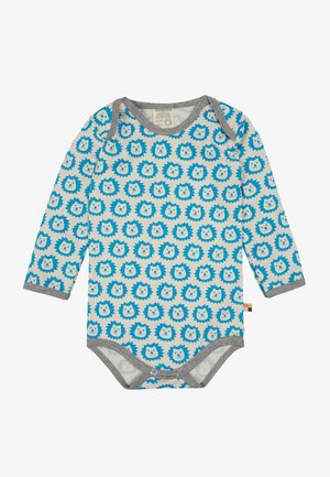 Pagliaccetto a maniche lunghe di un beige chiaro con un motivo di faccia di leone blu. Bordo grigio attorno al collo e alle aperture delle gambe, dotato di chiusure a scatto nella parte inferiore.