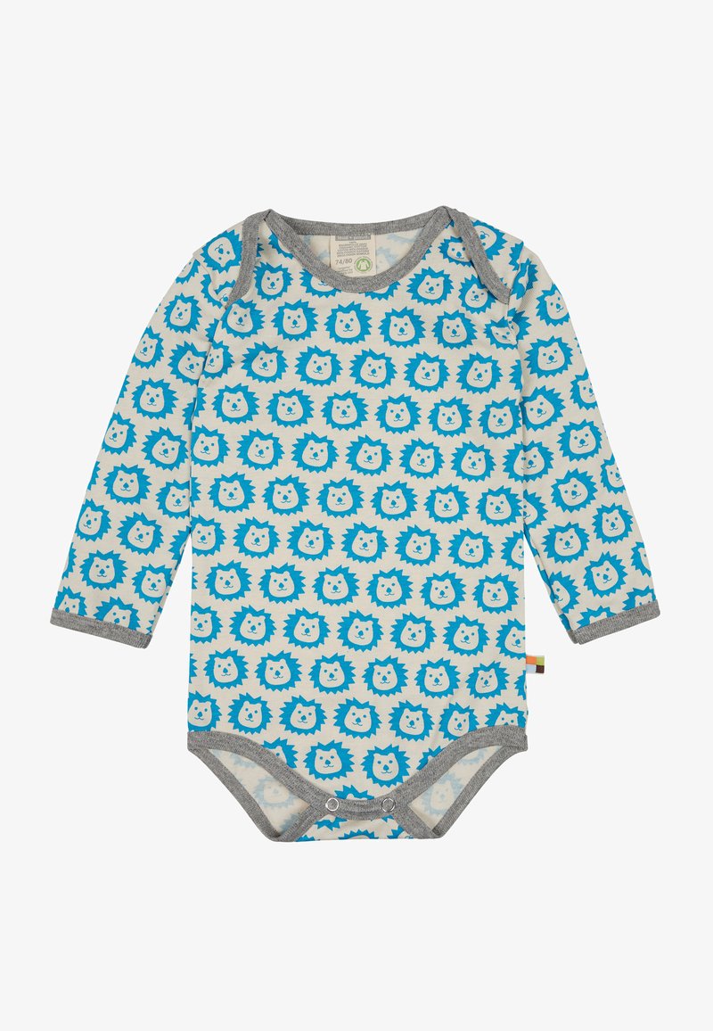 Pagliaccetto a maniche lunghe di un beige chiaro con un motivo di faccia di leone blu. Bordo grigio attorno al collo e alle aperture delle gambe, dotato di chiusure a scatto nella parte inferiore.