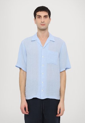 Light blue short-sleeve button-up shirt in a sheer linen fabric with a single chest pocket and a relaxed fit.