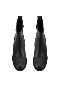 Bottines en cuir noir avec une texture lisse, bout arrondi, zips latéraux et languettes pour un enfilage facile. Design de silhouette épurée.