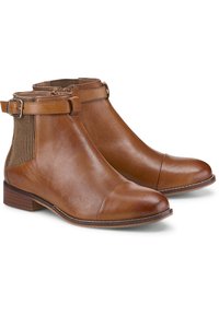 Brązowe skórzane botki za kostkę o gładkim wykończeniu, z wanienką z materiału z podłużnym wzorem, regulowanym akcentem klamry oraz niskim, złożonym obcasem.