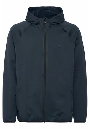 Mornarska zip-up dukserica, napravljena od mekanog materijala, ima prilagođenu kapu, raglan rukave i dva bočna džepa. Minimalni akcent na grudima.