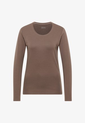 Pitkähihainen yläosa ruskeana, valmistettu sileästä kankaasta. Siinä on pyöreä pääntie, joka on yksinkertainen ilman lisäkoristeita tai kuvioita.