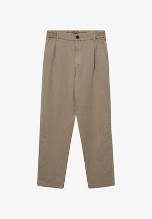 Beige Freizeithose mit elastischem Bund an den Seiten, Knopf- und Reißverschluss sowie Seitentaschen, flach auf weißem Hintergrund ausgelegt.