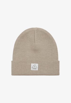 Beanie muts in lichtbeige, gebreide textuur, met een opgerolde rand. Bevat een klein wit label met een bergafbeelding en merknnaam.