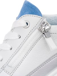 White sneaker showing side zipper, white laces, blue padded collar, and metallic silver stripe details.