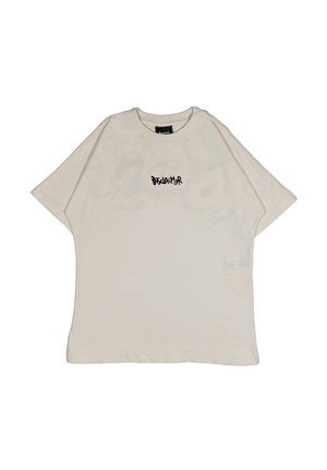 T-shirt oversize beige in cotone, con colletto rotondo, maniche corte e la scritta "Disclaimer" stampata in nero sulla parte anteriore.