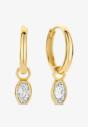 Goldene Creolen mit einem glatten Design, an denen jeweils ein ovaler, klarer Edelstein-Anhänger hängt. Polierte Metalloberfläche.